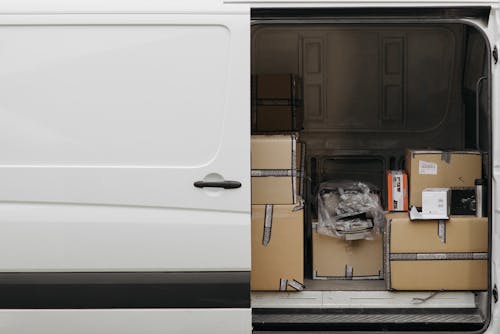 Free Delivery Van with Boxes Inside Stock Photo